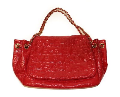 Lot 2146 - Circa 2008/2009 Chanel Red Patent Puzzle Flap Bag, with a jigsaw puzzle inspired stitched...