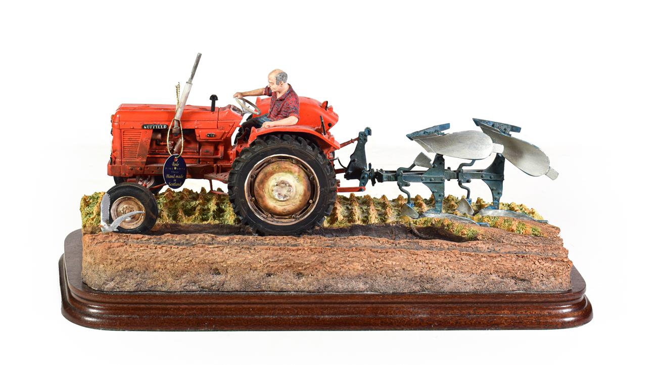 Lot 66 - Border Fine Arts 'Reversible Ploughing' (Nuffield 4/65 Diesel Tractor), model No. B0978 by Ray...