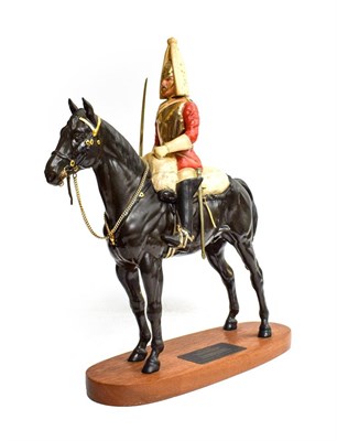 Lot 109 - Beswick Connoisseur Lifeguard, (Style two: with sword), model No. 2562, black matt, on wooden...