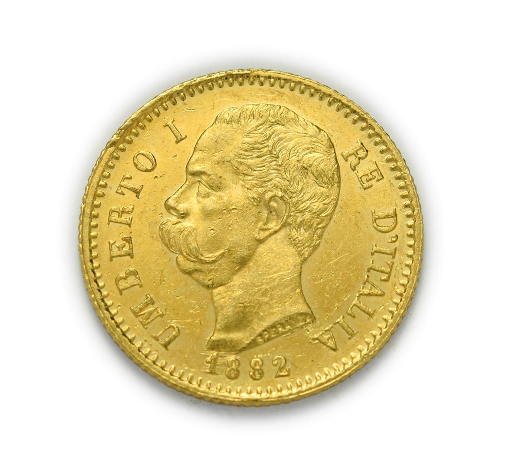 Lot 4072 - Italy, Umberto I (1878 - 1900), 1882 R Twenty Lire. 6.45g of .900 gold. Rome mint. Obv: Bare...