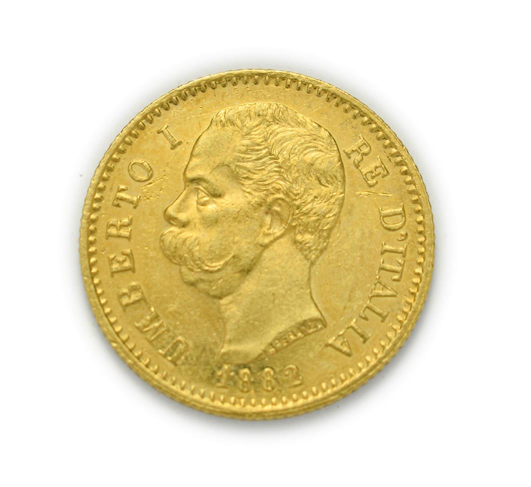 Lot 4073 - Italy, Umberto I (1878 - 1900), 1882 R Twenty Lire. 6.45g of .900 gold. Rome mint. Obv: Bare...