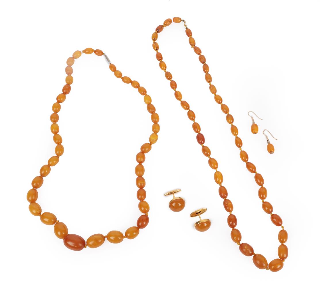 Lot 2012 - Two Amber Bead Necklaces, formed of forty-one and forty-four graduated amber beads, lengths...