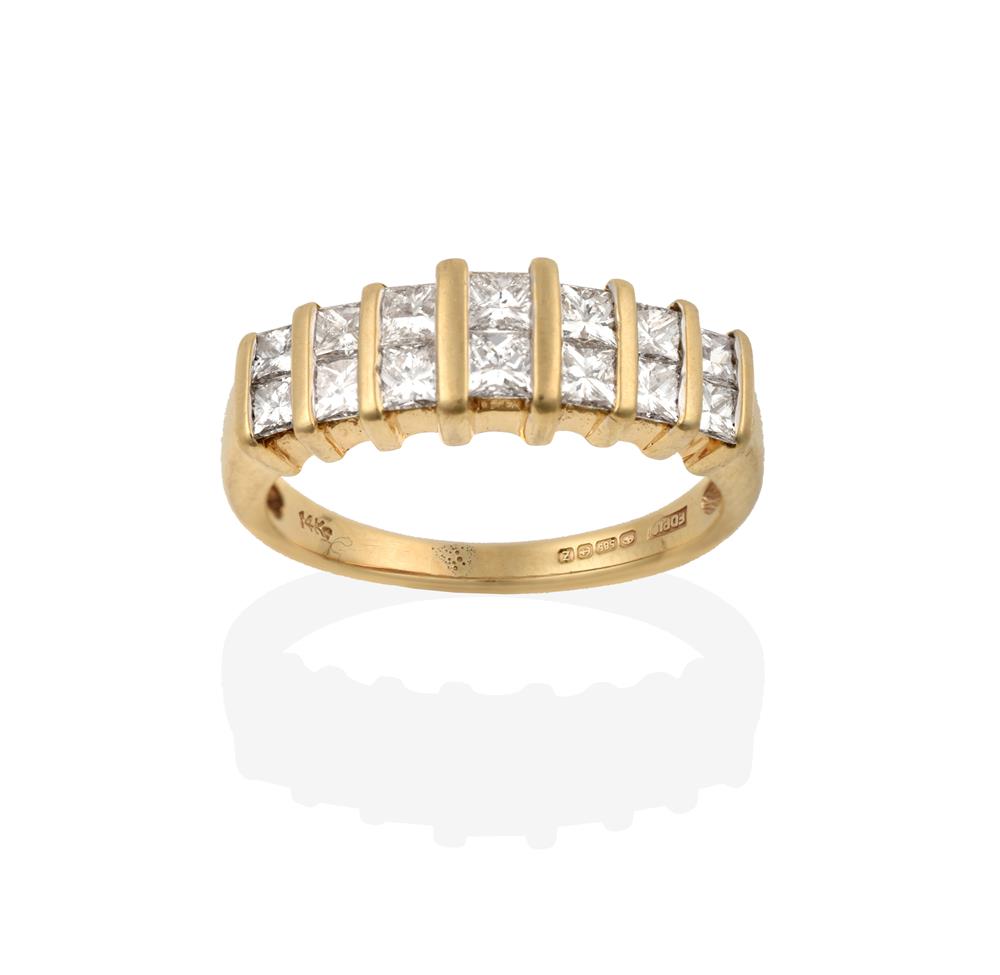 Lot 2017 - A 14 Carat Gold Diamond Half Hoop Ring, the two rows of graduated princess cut diamonds spaced...