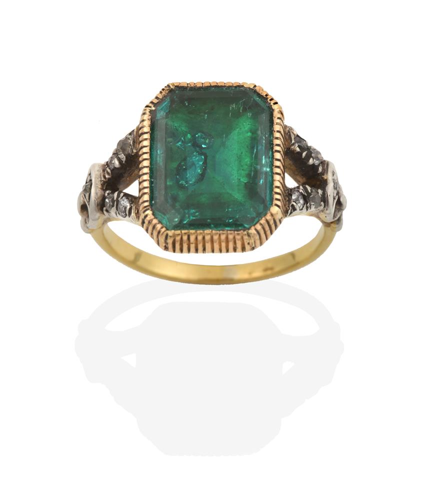 Lot 2031 - A Georgian Emerald and Diamond Ring, the emerald-cut emerald in a yellow millegrain setting, to...