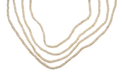 Lot 2037 - A Seed Pearl Necklace, the four rows of seed pearls knotted to a torpedo shaped clasp set...