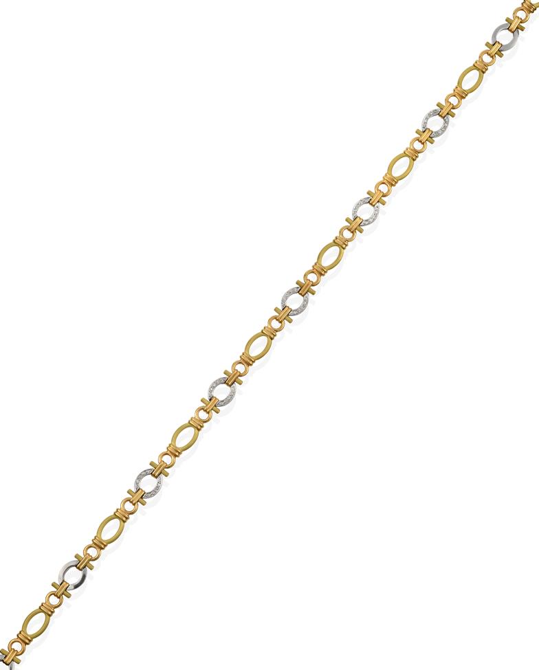 Lot 2058 - An 18 Carat Gold Diamond Fancy Link Necklace, by Boodle & Dunthorne, eight yellow textured oval...