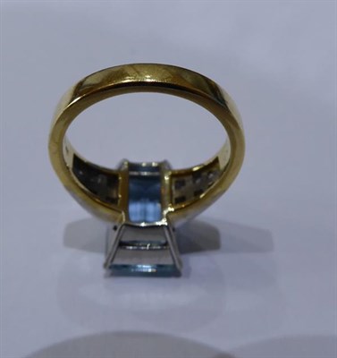 Lot 2062 - An 18 Carat Gold Aquamarine and Diamond Ring, the emerald-cut aquamarine in a white four claw...