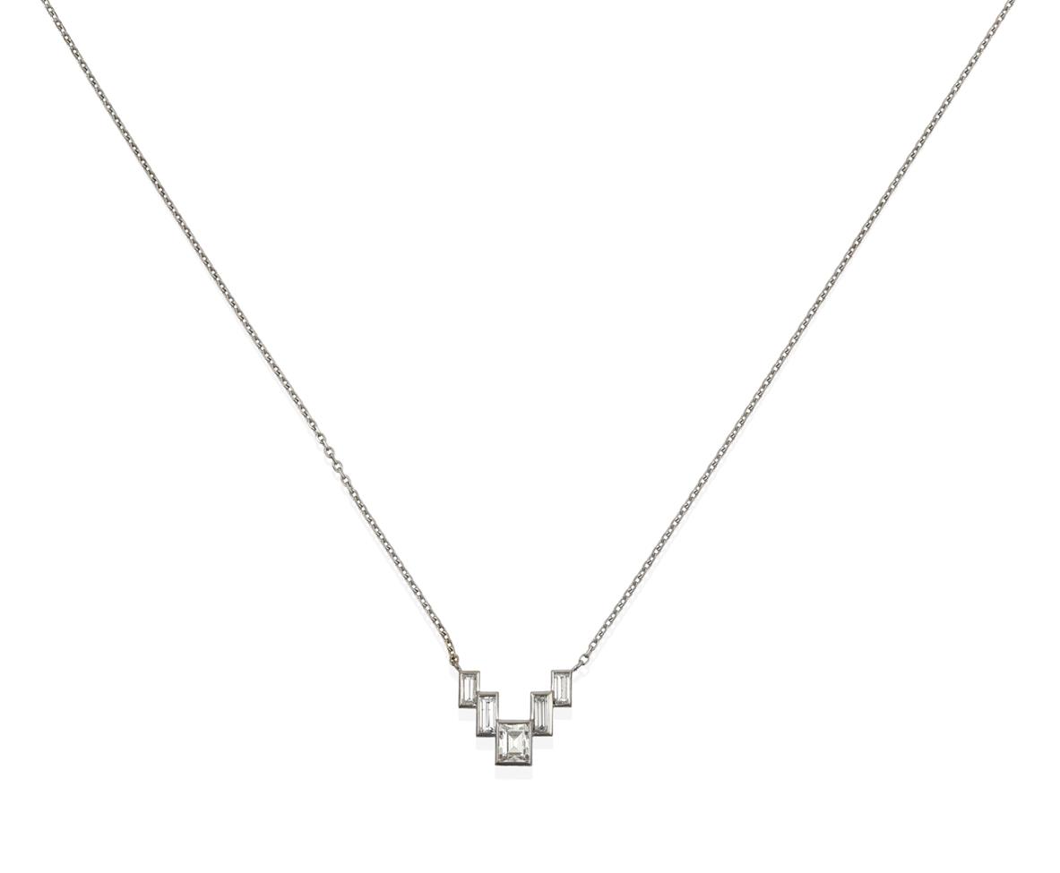 Lot 2092 - A Diamond Necklace, mounted by Cartier, five graduated step cut diamonds in white rubbed over...