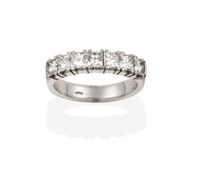Lot 2101 - An 18 Carat White Gold Diamond Seven Stone Ring, the princess cut diamonds in claw settings, to...