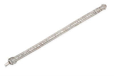 Lot 2108 - An 18 Carat White Gold Diamond Line Bracelet, formed of three rows, the central row of tapered...