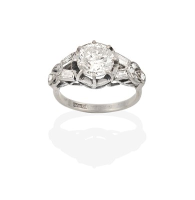 Lot 2109 - A Diamond Solitaire Ring, the round brilliant cut diamond in a white claw setting, to fancy...
