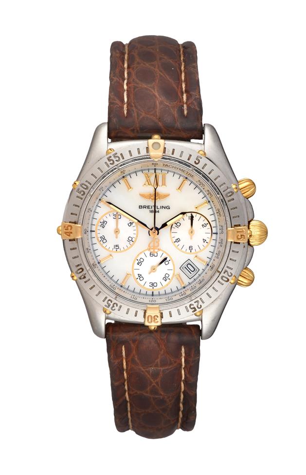 Lot 2133 - A Steel and Gold Calendar Chronograph Wristwatch, signed Breitling, model: Chrono Jetstream,...