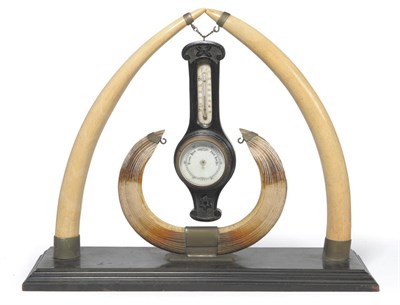Lot 1087 - An Elephant and Hippopotamus Tusk Mounted Barometer Stand, circa 1890, as two small elephant...