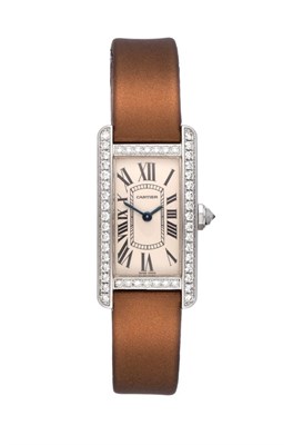 Lot 2173 - A Lady's 18 Carat White Gold Diamond Set Wristwatch, signed Cartier, model: Tank Americaine,...