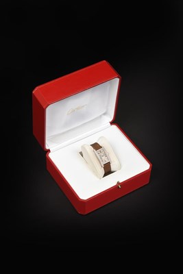 Lot 2173 - A Lady's 18 Carat White Gold Diamond Set Wristwatch, signed Cartier, model: Tank Americaine,...