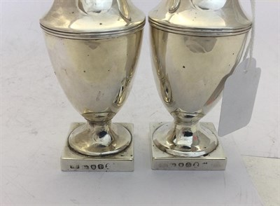 Lot 2195 - A Pair of George III Silver Pepperettes, Maker's Mark IC, London, 1792, each vase-shaped and on...