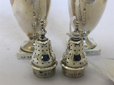 Lot 2195 - A Pair of George III Silver Pepperettes, Maker's Mark IC, London, 1792, each vase-shaped and on...