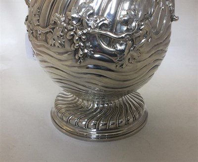 Lot 2202 - A George III Silver Wine-Jug, by Thomas Heming, London, 1765, pear-shaped and on spiral-fluted...