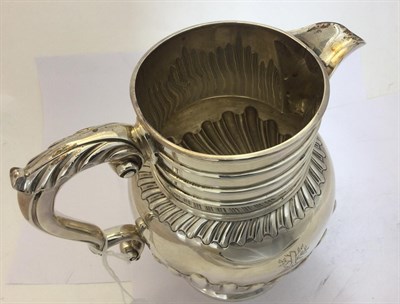 Lot 2239 - A Victorian Silver Jug, by John and Frank Pairpoint, London, 1894, baluster and on spreading...