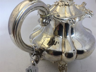 Lot 2250 - A Victorian Silver Teapot, by Joseph and John Angell, London, 1838, melon-fluted and on cast...