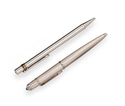 Lot 2321 - A Cartier Diabolo Ballpoint-Pen, Numbered 232407, with engine-turned finish, the top with a...