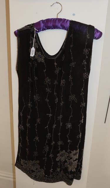 Lot 1035 - Black chiffon sleeveless 'flapper' dress with bead decoration in a floral design
