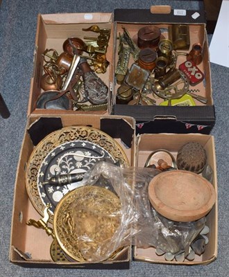 Lot 1110 - Assorted metal wares including an embossed copper powder flask, money boxes, jelly moulds,...