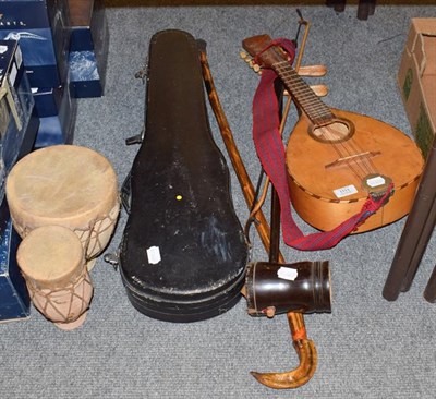 Lot 1111 - A mandolin, a cased Chinese violin, an erhu, walking stick and terracota bongos (4)