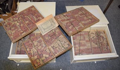 Lot 1214 - Two painted homemade crates containing twelve trays of Victorian Richter building blocks...