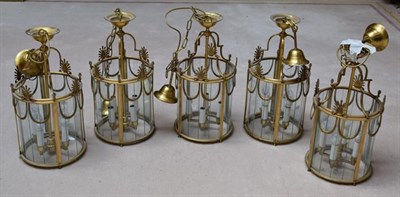 Lot 1221 - A set of five Regency style four light glazed gilt metal lantern form ceiling lights 56cm (5)