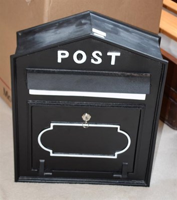 Lot 1222 - A modern black painted cask metal postbox, 42cm by 20cm by 52cm