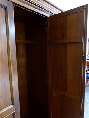 Lot 1228 - A Willis & Gambier reproduction bedroom suite comprising a triple door wardrobe, 175cm by 65cm...