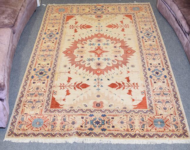 Lot 1247 - Feraghan design rug, the cream field with separated medallion framed by borders of stylised plants
