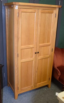 Lot 1251 - A modern double door wardrobe, 90cm by 50cm by 171cm