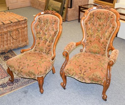 Lot 1258 - Two Victorian buttoned spoon backed armchair, walnut framed with floral upholstery (2)