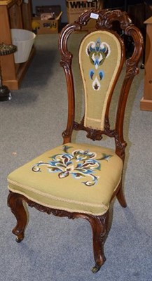Lot 1263 - A Victorian walnut nursing chair