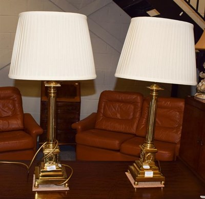 Lot 1271 - A pair of gilt brass columnar table lamps with silk shades, 52cm