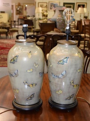 Lot 1273 - A pair of modern Chinese table lamps decorated with butterflies, 47cm