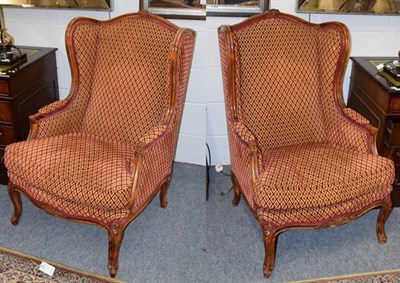 Lot 1274 - A pair of modern French upholstered wingback chairs by Joanna Marco interiors