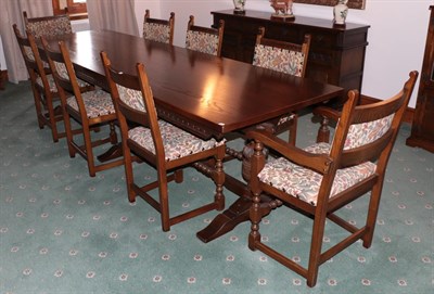 Lot 1284 - A Wood Brothers reproduction carved oak refectory style 10ft dining table, raised on carved bulbous