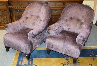 Lot 1289 - A pair of modern button back purple upholstered low armchairs (2)