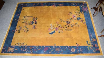 Lot 1293 - Chinese ''Art Deco'' carpet, the gold field sparsely decorated with flowering plants enclosed...