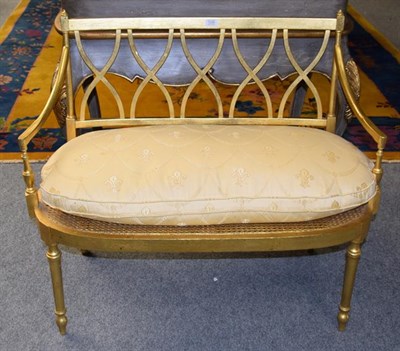 Lot 1295 - A Regency style gilt framed caned salon sofa, 100cm wide