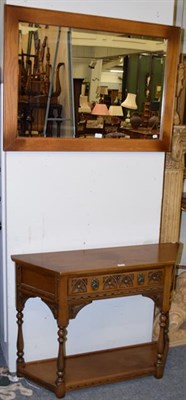 Lot 1301 - A Wood Brothers reproduction oak console table of triangular form, with single drawer, with...