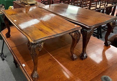 Lot 1317 - A pair 20th century of mahogany coffee tables with carved legs on claw and ball feet, 58cm by 116cm