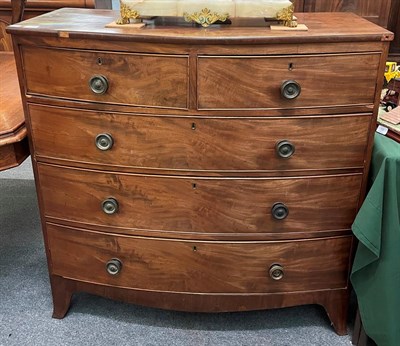 Lot 1319 - A Regency mahogany bow-front chest of drawers, 2nd quarter 19th century, two short over three...