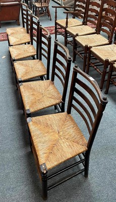Lot 1321 - A set of six rush seated ladder back chairs (6)