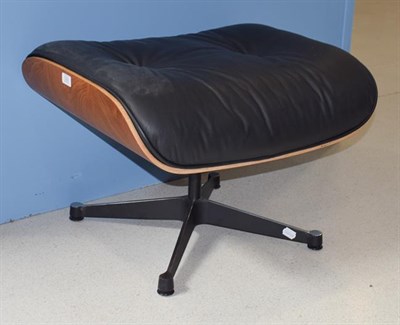 Lot 1323 - A leather footstool in the manner of Charles & Ray Eames, 64cm by 54cm by 44cm high
