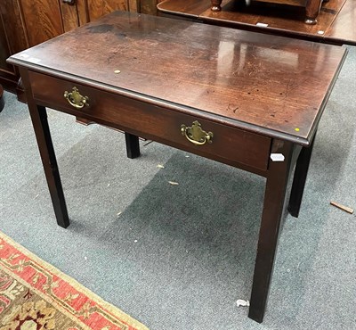 Lot 1328 - A George III mahogany single-drawer side table raised on square supports, 91cm by 57cm by 72cm