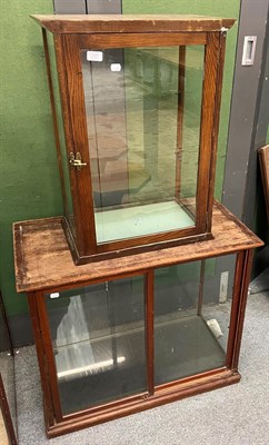 Lot 1331 - An Edwardian mahogany glazed shop display cabinet, 81cm by 43cm by 69cm high and another...